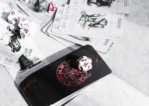 A table with dice and a book on it