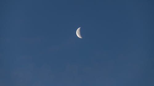 A crescent moon is seen in the sky
