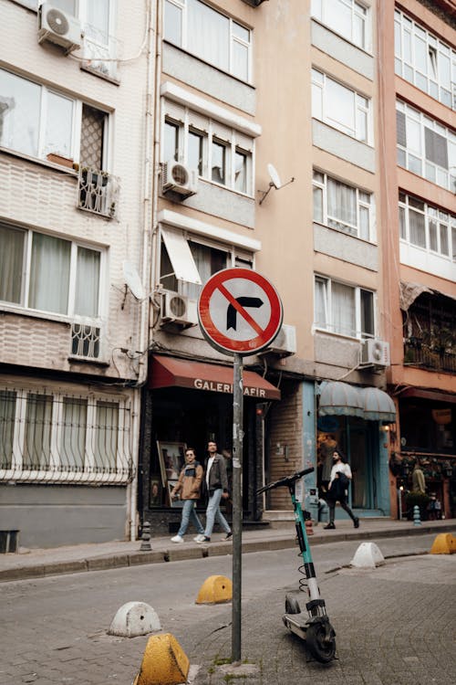 A street sign with a no parking sign on it