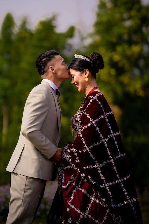 The Groom Kissing the Bride on the Forehead 