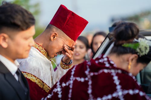A Man Crying during a Wedding 