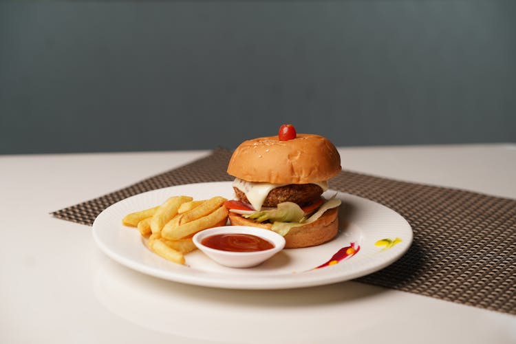 Hamburger And Fries On Plate