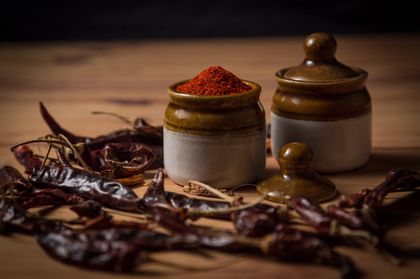 Rustic paprika spice jars with dried peppers — photo by Ajit Pendse on Pexels
