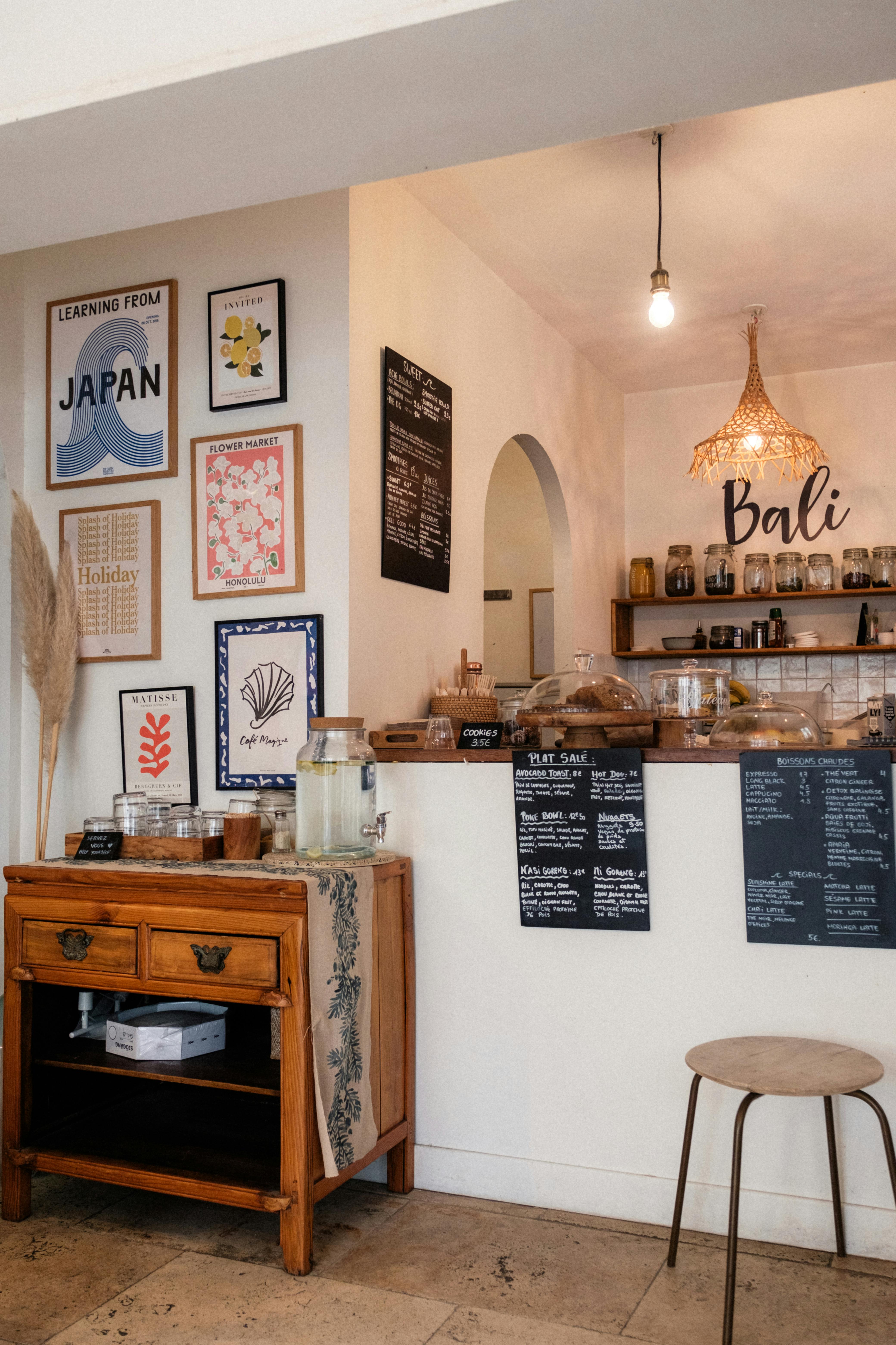 Charming café with rustic decor and menu boards in Biarritz, France.