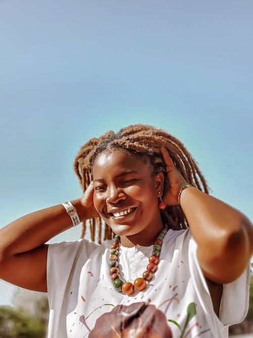 Smiling Woman with Dreadlocks