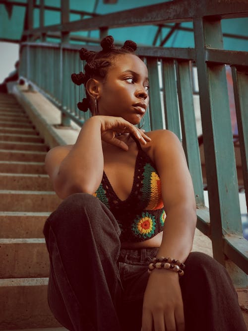 Woman Sitting on Stairs