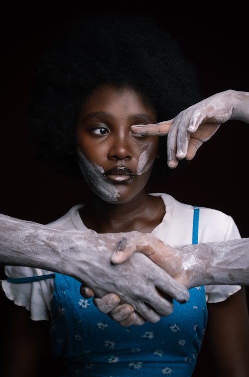 White Paint on Hands around Woman