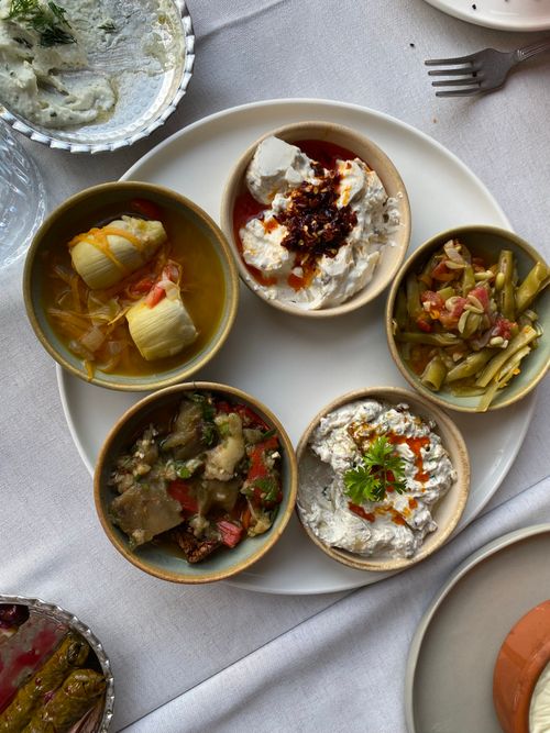 Free A variety of Mediterranean appetizers served in bowls with fresh vegetables. Stock Photo