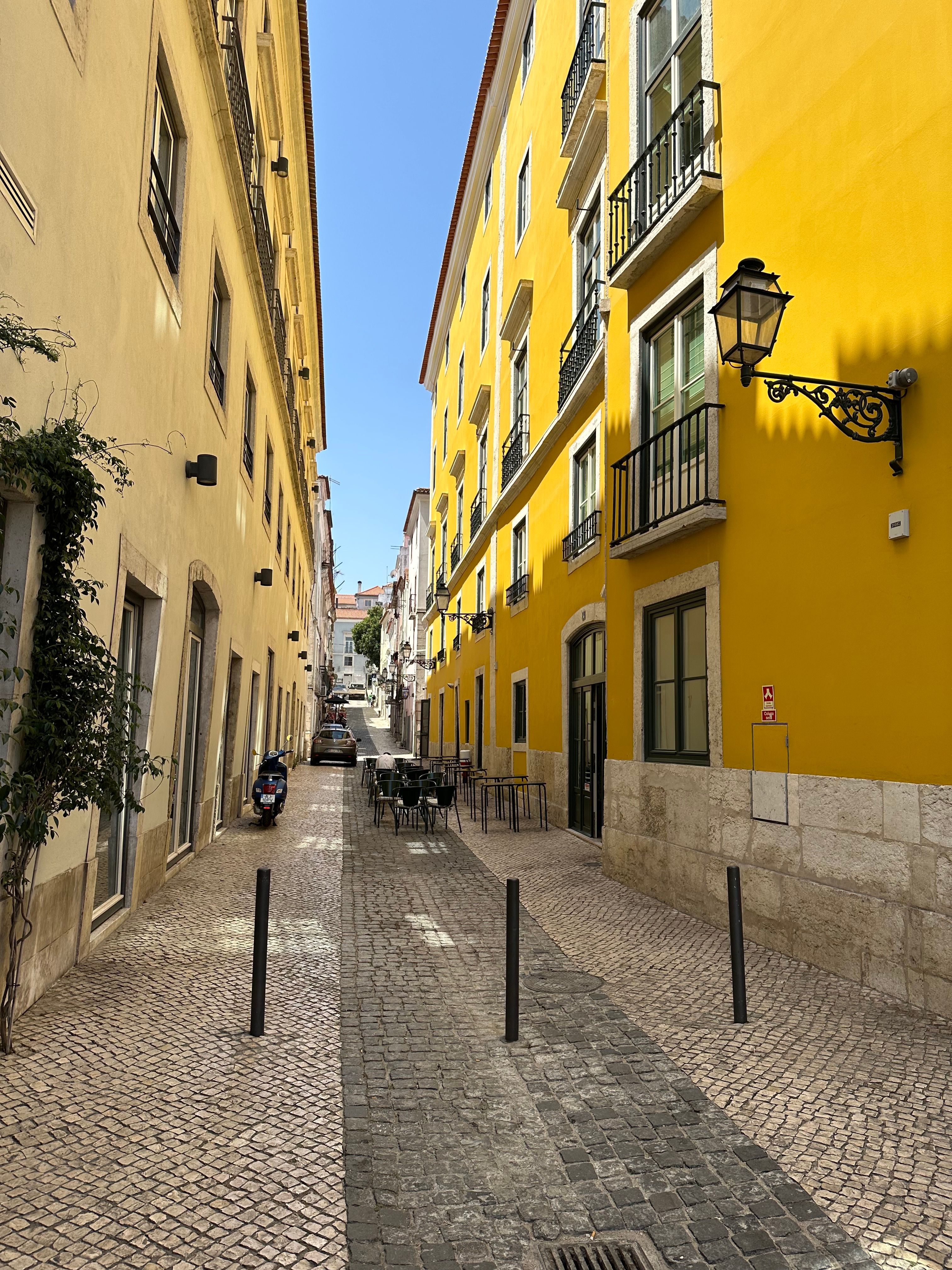 Narrow, Cobblestone Street in Lisbon · Free Stock Photo