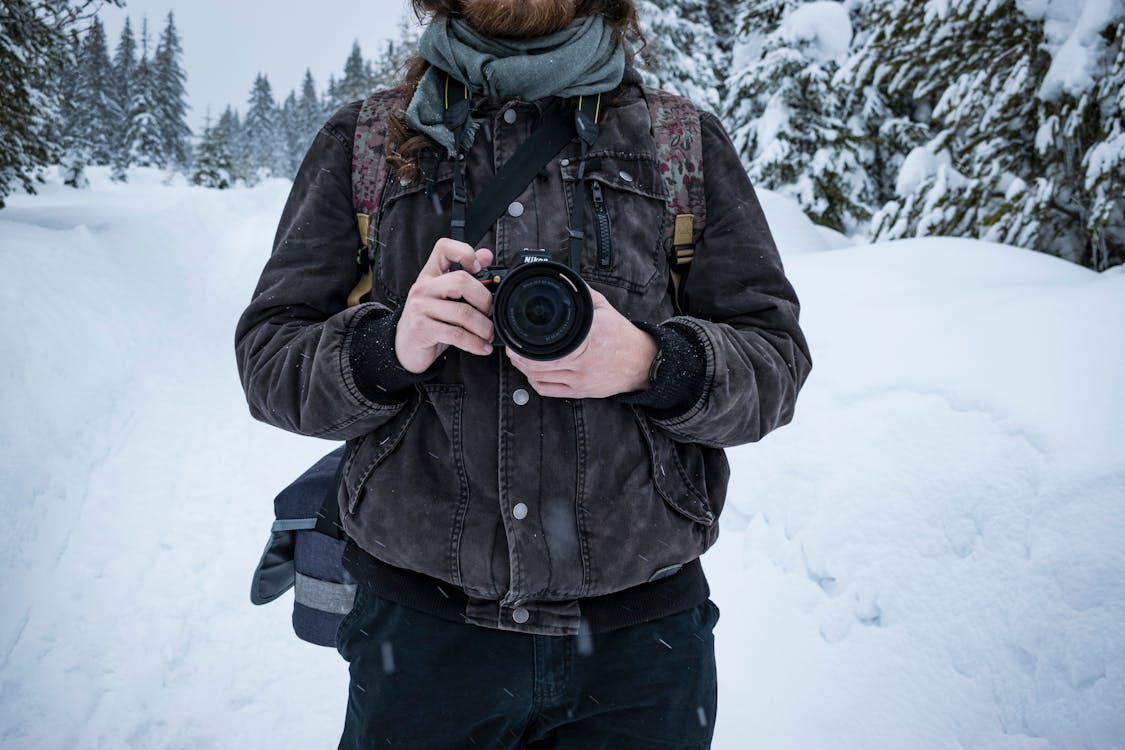 Man Holding Dslr Camera