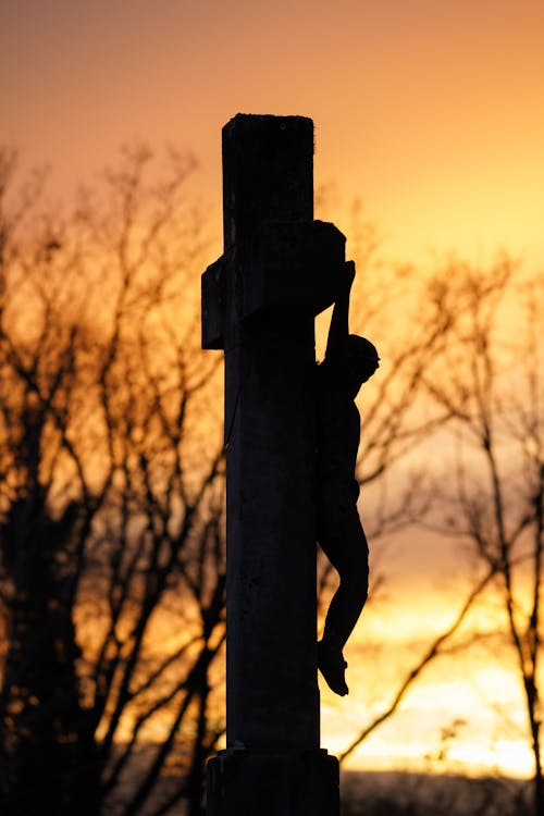 Jesus Christ on Cross at Sunset