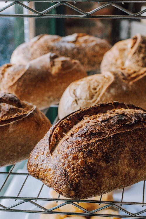 A rack of breads sitting on top of a window