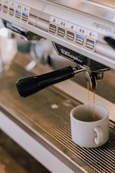 Close-up of espresso pouring from a coffee machine into a cup in a Buenos Aires cafe.