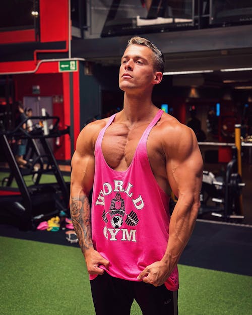 Man in Pink Tank Top at Gym