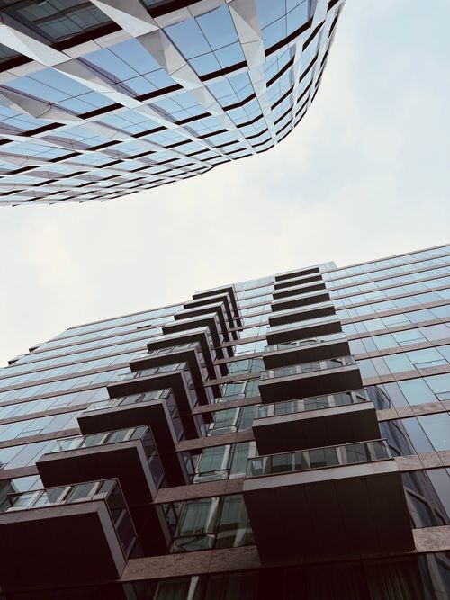 Free Low angle view of modern skyscrapers with unique balconies showcasing contemporary architecture. Stock Photo