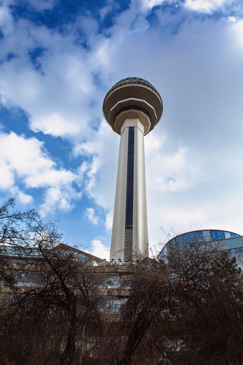 Free Low-angle view of Atakule Observation Tower against a cloudy sky in Ankara, Türkiye. Stock Photo