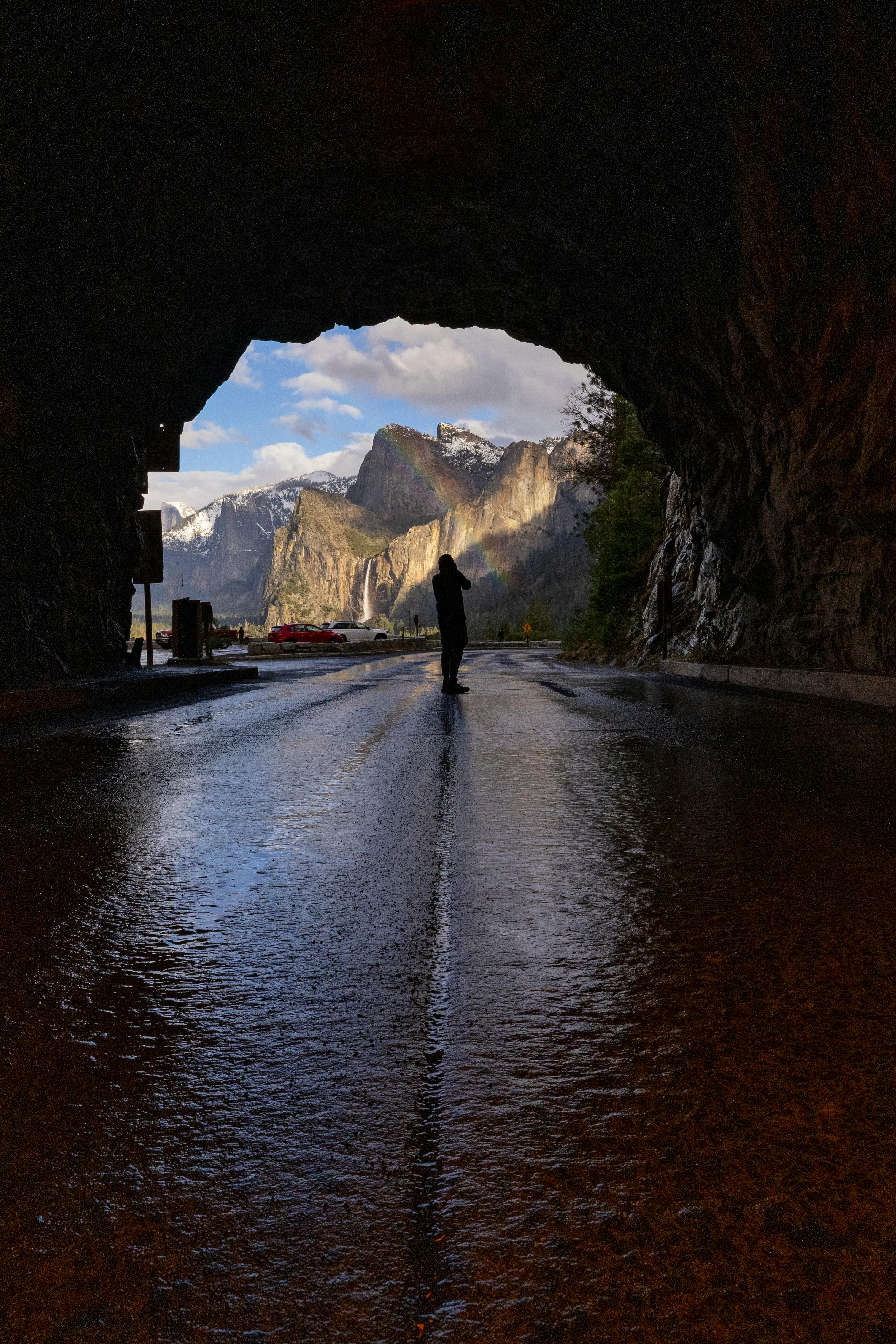 Dramatic silhouette view through a tunnel in Yosemite with breathtaking landscapes.