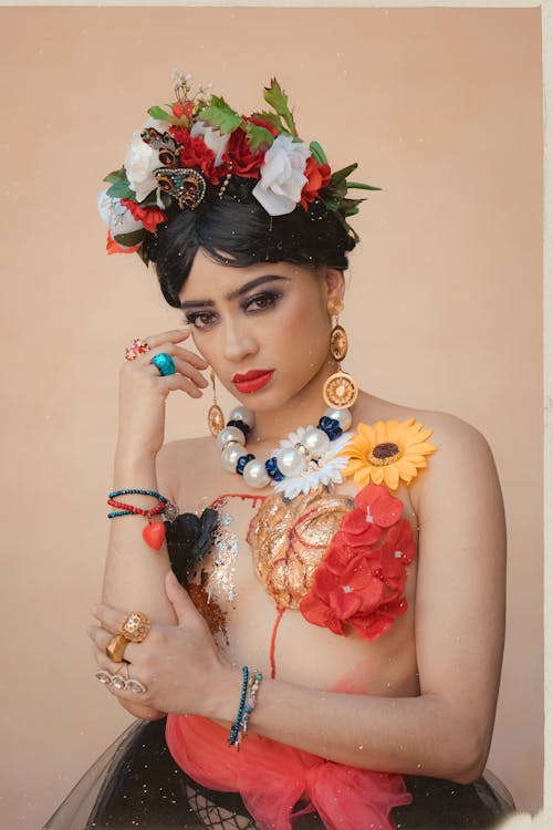 A woman wearing a flower crown and jewelry