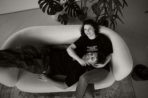 Smiling Couple on Couch in Black and White