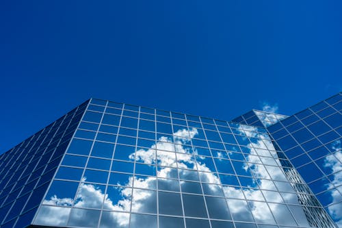 Clouds Reflecting On Curtain Wall Building