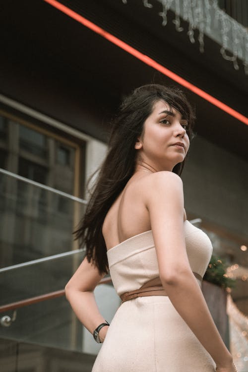 Woman Wearing Beige Costume on a Street 