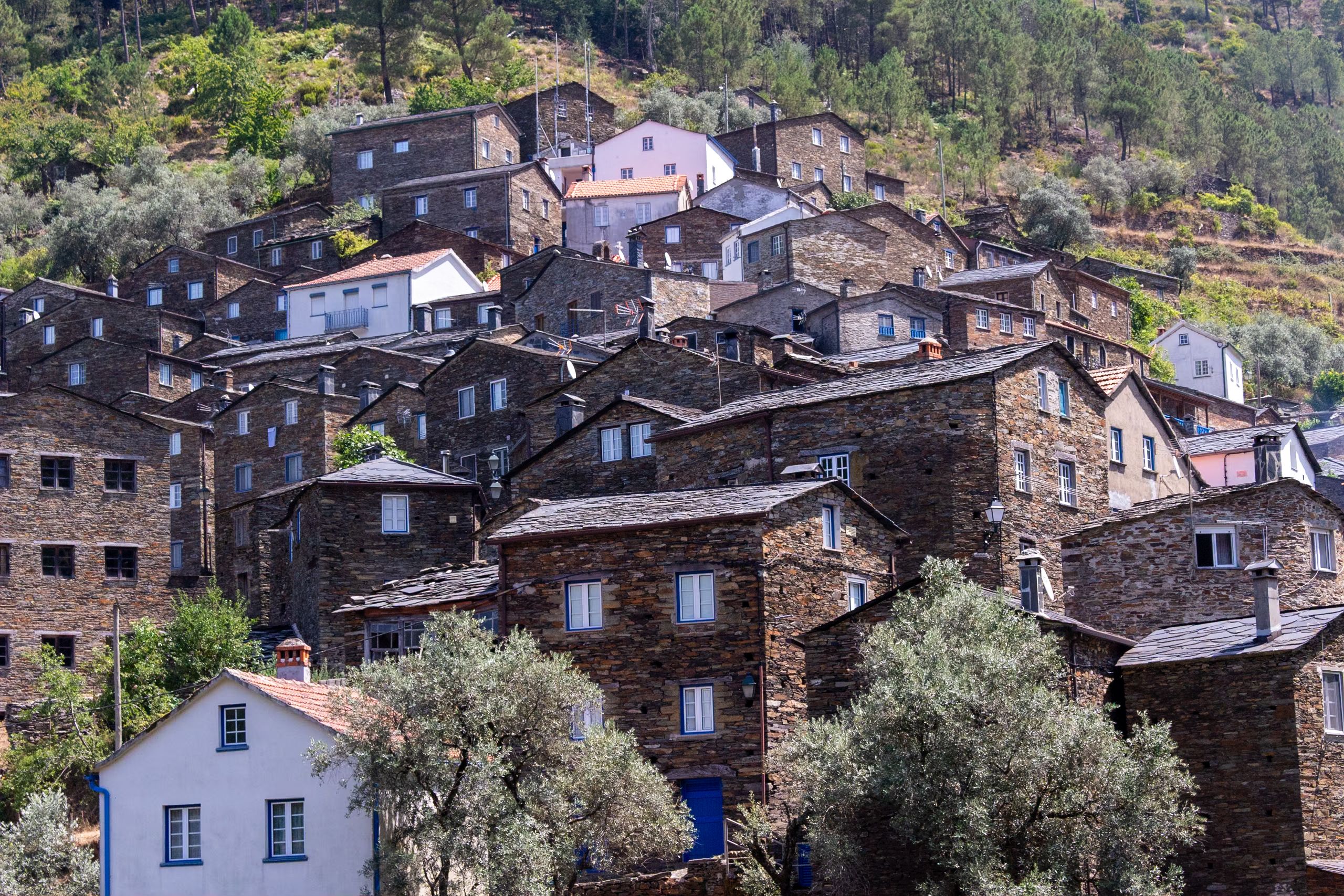 Explore the historic charm of Piódão village with its unique stone architecture nestled in Portugal's scenic mountains.