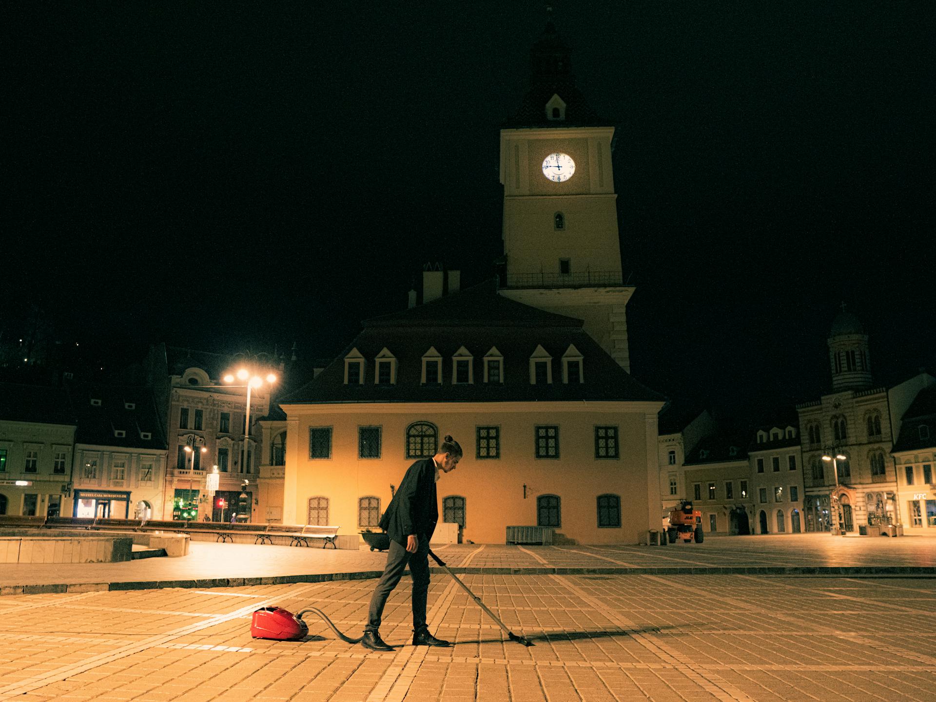 Man with Vacuum Cleaner at The Council Square in Brasov in Romania
