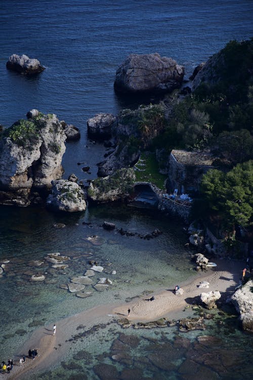 Aerial view of a beach and rocks near the water