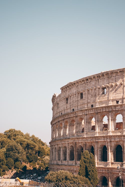 Ingyenes stockfotó Colosseum, épület, fák témában