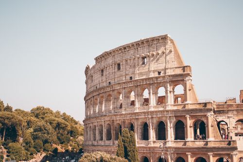 Free View of the ancient Colosseum in Rome with a clear sky. Stock Photo