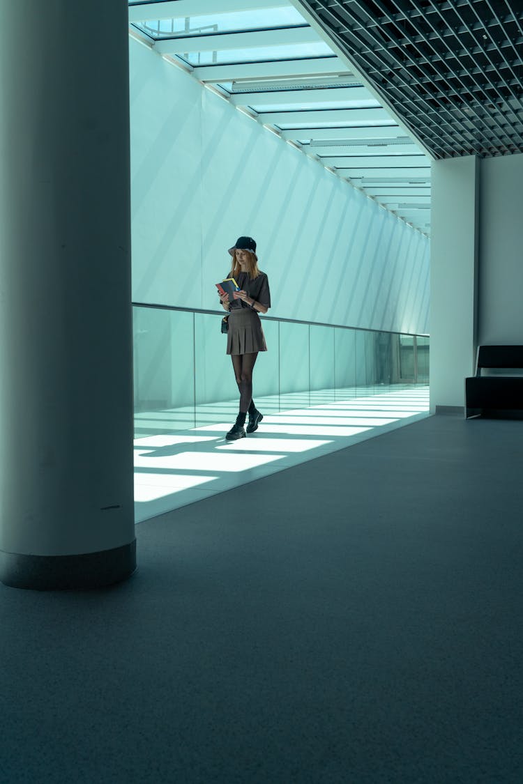 Woman Walking On Glass Floor In An Office Building 