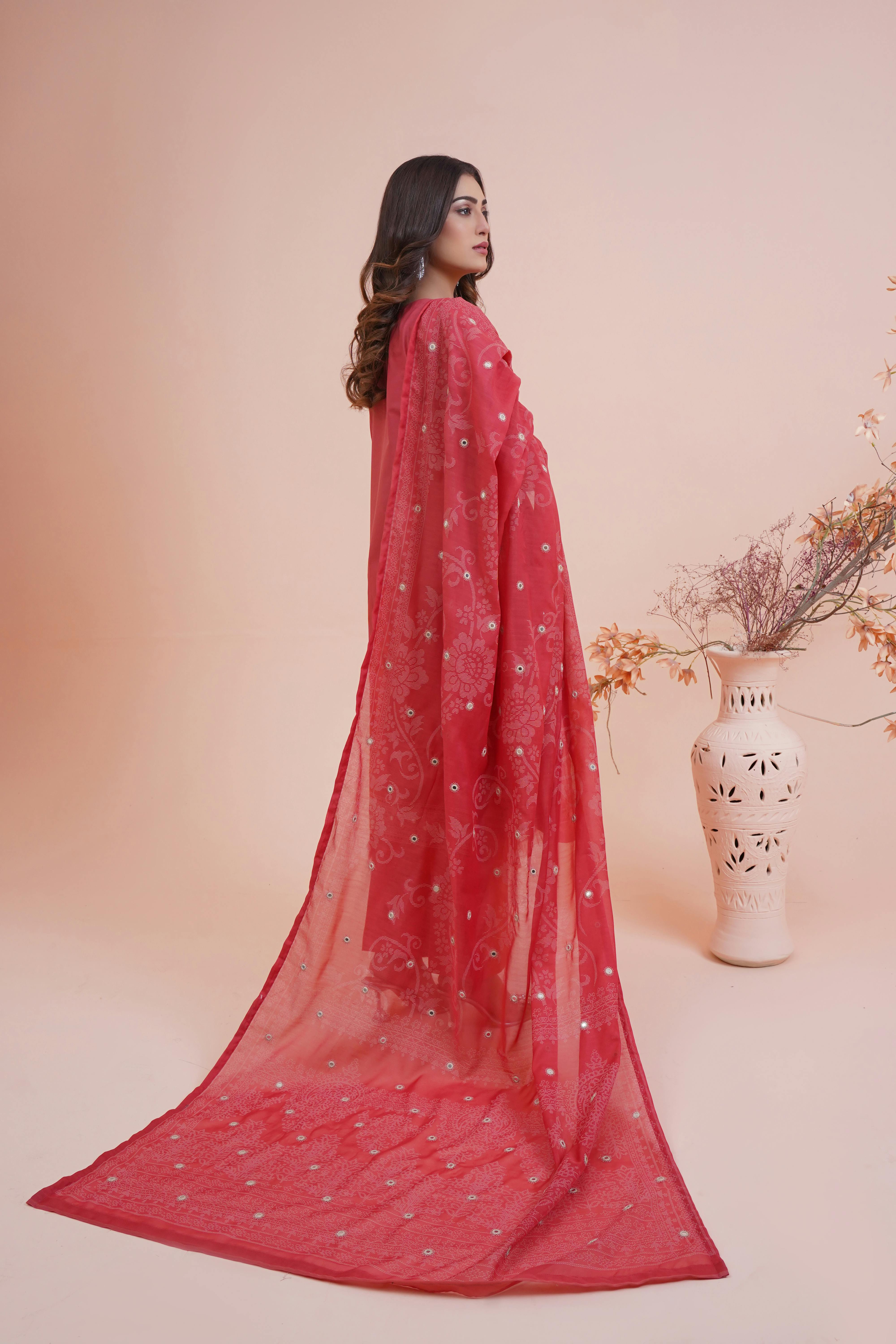 studio shot of a woman wearing a red dress