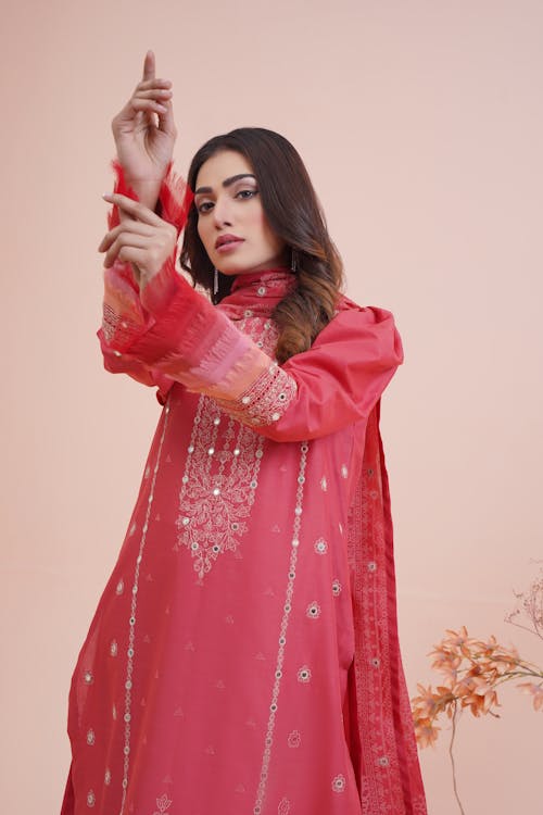 Studio Shot of a Young Woman Wearing a Pink Gown 