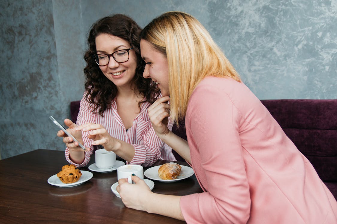 Free Two Women Looking On Smartphone Stock Photo