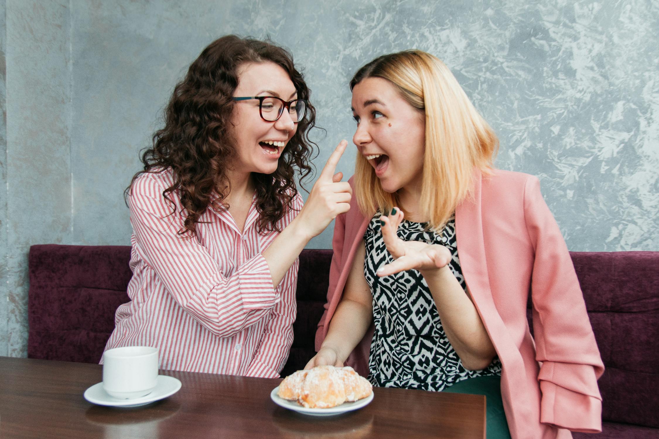 Happy Friends Together in a Café