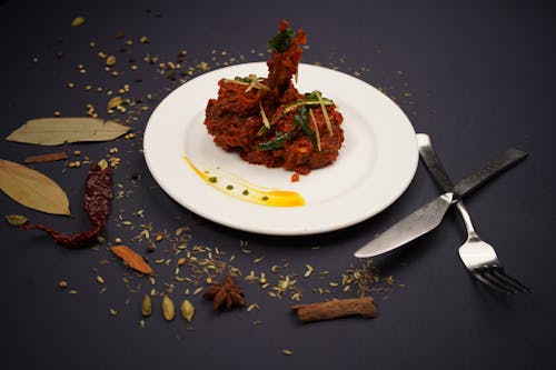 Indian Chicken Dish Arranged on Plate with Decorations