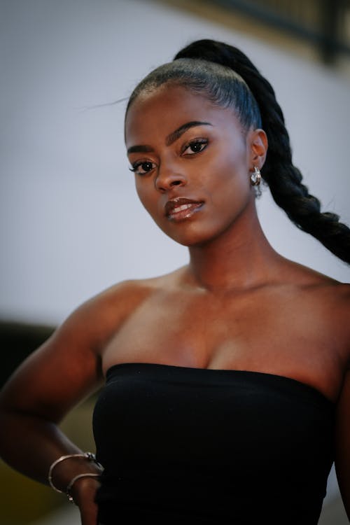 A woman with long hair in a black top