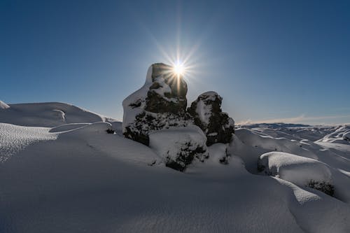 Sunset Sunlight over Rocks in Snow