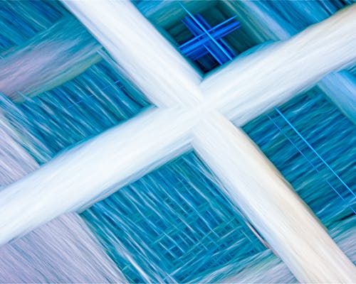 A close up of a blue and white cross