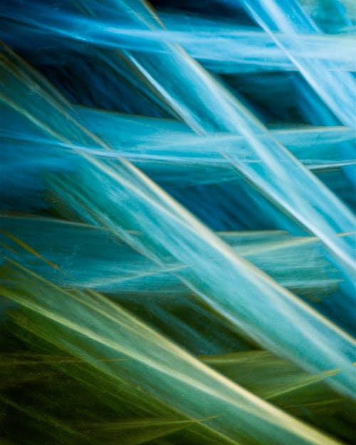 A close up of a blue and green abstract painting