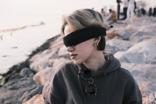 Portrait of Blonde Woman in Blindfold