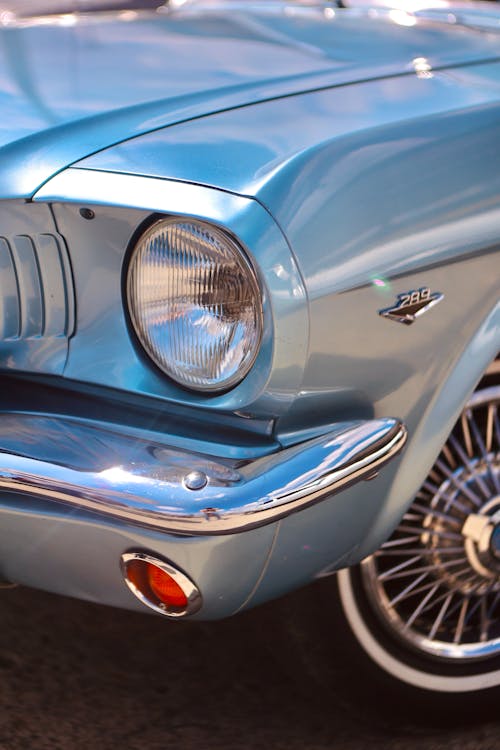 A close up of a blue mustang car