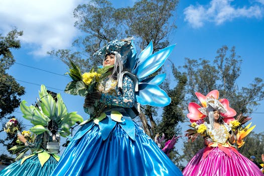 Women in vibrant floral costumes at the Baguio Flower Festival parade.