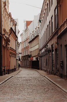 Explore the historic cobblestone streets of Old Riga, Latvia, showcasing beautiful architecture.