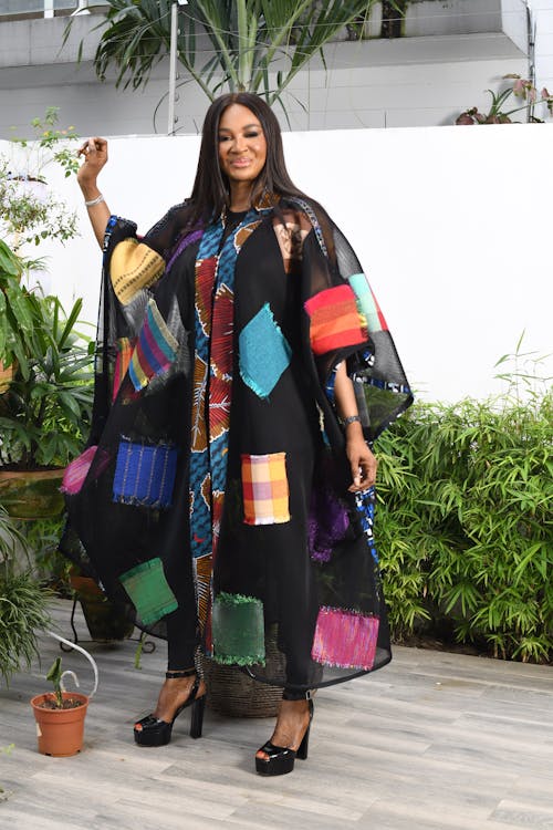 A woman in a colorful african dress