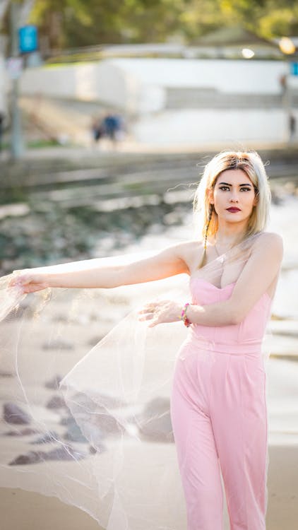 Woman in Pink Romper and Veil