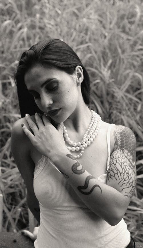 Model Wearing Tank Top and Pearls