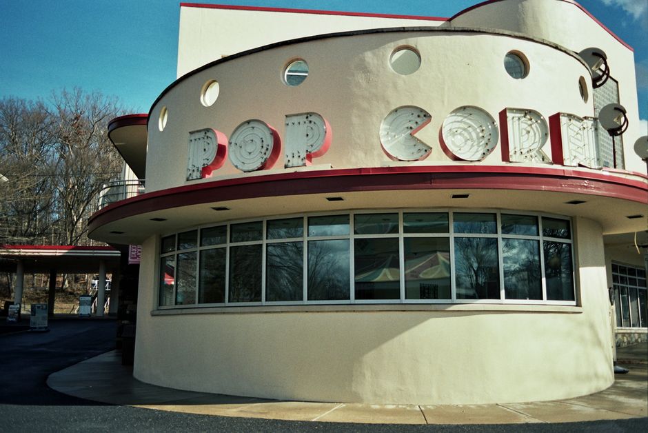 Vintage Art Deco popcorn stand at Glen Echo Park, MO, captured on a sunny day.