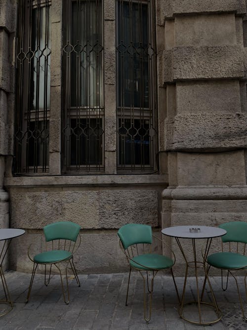 A table and chairs outside a building