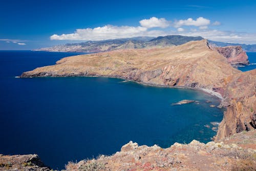 A view of the ocean and a rocky coastline